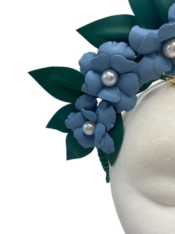 Large blue leather flower crown with green leather leaf detail.
